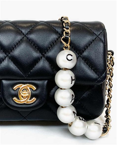 chanel bag pearl chain|Chanel small quilted bag.